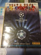 Panini album na naklejki z kilkoma naklejkami w środkuchampions league13/14