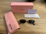 Okulary damskie Miu Miu