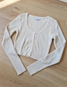 Kremowy prążkowany crop / krótki sweterek zapinany na guziki