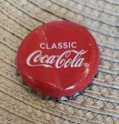 Kapsel Coca-Cola butelkowane