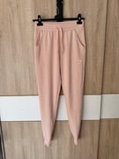 Dresy Gymshark XS damskie spodnie dresowe pudrowy róż 56% wiskoza