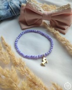 Bransoletka z masy perłowej ze złotą zawieszką koniem ze stali szlachetnej