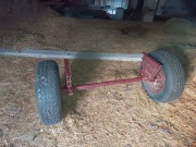 Oś z kołami do przyczepy