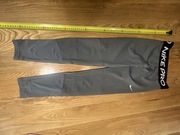 Szare spodnie długie Nike 134 cm