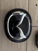 MAZDA 6 GL LOGO EMBLEMAT POD RADAR SZKIEŁKO