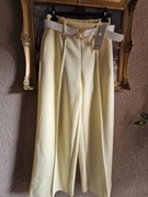 Spodnie damskie szerokie nogawki z kantem z paskiem cytrynowe typ masełko