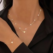 Złoty naszyjnik i bransoletka z sercem