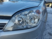 Reflektor lewy przód Opel Astra H Lift 1EG270370-02