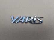 TOYOTA YARIS CROSS 21-  logo klapy tylnej 75442-K2010