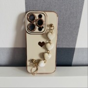 Etui iPhone 14 Pro – nowe, złote wykończenia i serduszka