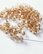 Kryształki Swarovski Bicons 4mm Light Colorado Topaz – 99 sztuk