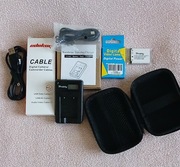 Zestaw do aparatu cyfrowego  -Etui 7cm.x11cm. +bateria+ładowarka+kabel