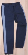 Granatowe Spodnie z niebieskim lampasem marki Mohito w rozm 34 używane