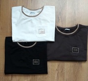 MEGI bluza kieszonka z naszywką biała