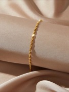 Bransoletka twisted z serduszkiem