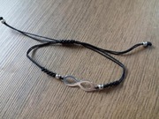 Regulowana bransoletka. Czarny sznurek. Srebrny znak nieskończoności