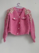 Sweterek różowy zapinany 