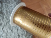 Złota taśma wstążka tasiemka