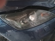 Focus 2 lift-lampa prawy przód,przyciemniana-oryg. ford.