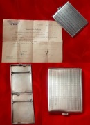 stara srebrna papierośnica ze świadectwem badania