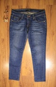Spodnie Levi's r. S/M 7 Medium 524 damskie długie bawełna niebieskie 