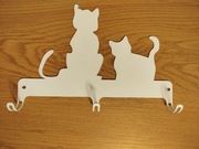 Metalowy wieszak koty biały