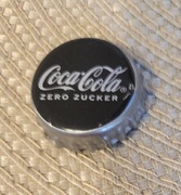 Kapsel Coca-Cola butelkowane