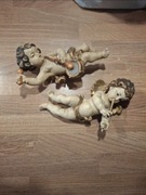 Aniołki putto. Grający na fletni i bębenku 