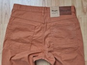 Nowe pomarańczowe spodnie męskie jeans Wrangler Arizona W31l34