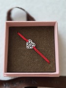 Srebna bransoletka na sznureczku W.KRUK