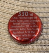 Kapsel Coca-Cola butelkowane