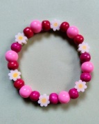 Bransoletka różowe koraliki białe kwiatki 