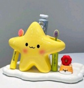 Uchwyt na szczoteczkę dla dzieci  Organizer łazienkowy Wesoła gwiazdka