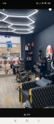 Wyposażenie salonu barberskiego. Barbershop  Fotele, szafki, kosmetyki.