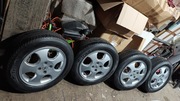 Felgi aluminiowe Opel Astra 15 4x100 z oponami lato 195/60