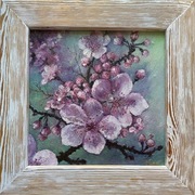 Gałązka sakury obraz w białej drewnianej ramie.