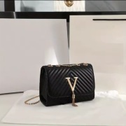 Damska torebka na ramię w paski z haftem