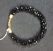 elegancka czarna bransoletka, plecionka, renomowanej firmy Jablonex,