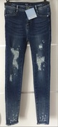 Nowe jeansy Controversy rozm. 34/36 XS/S dziury plamy wysoki stan