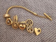 Pandora pozłacana bransoletka + charms