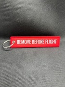 Brelok "REMOVE BEFORE FLIGHT" - czerwony