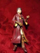 Figurka Harry Potter'a, w stroju do Quidditcha.