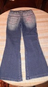 Spodnie jeansy z haftem 146