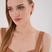 Naszyjnik stal chirurgiczna złoty – delikatny wisiorek kokarda