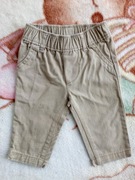 Beżowe eleganckie bawełniane spodnie Carter's 56 - 62 jak nowe