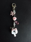 Brelok kot donut pączkot różowy przezroczysty biały motyl łapka 