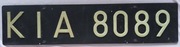 Tablica rejestracyjna z tworzywa z nitowanymi znakami Kielce PRL wz. 1976 