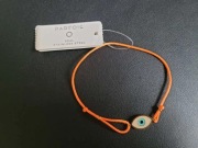 Bransoletka damska Parfois – z symbolem „Oka” na pomarańczowym sznurku
