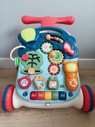 Interaktywny chodzik pchacz stolik zabawka do łóżeczka 