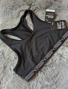 Czarny Biustonosz sportowy Puma Mid im pact Puma Elastic, rozmiar XL